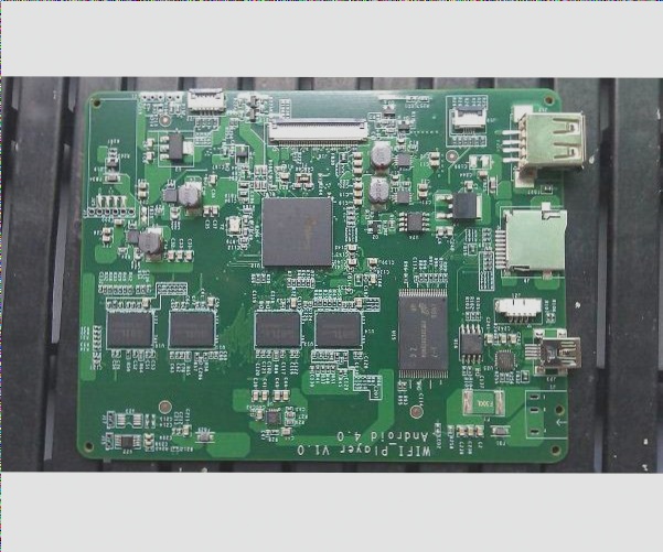 The aesthetic appearance of the green PCB substrate.