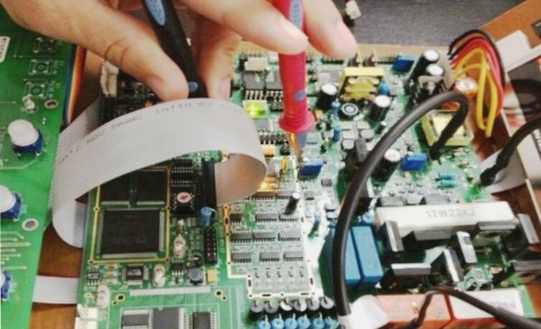 What are the risks associated with handling a PCB board with one hand?