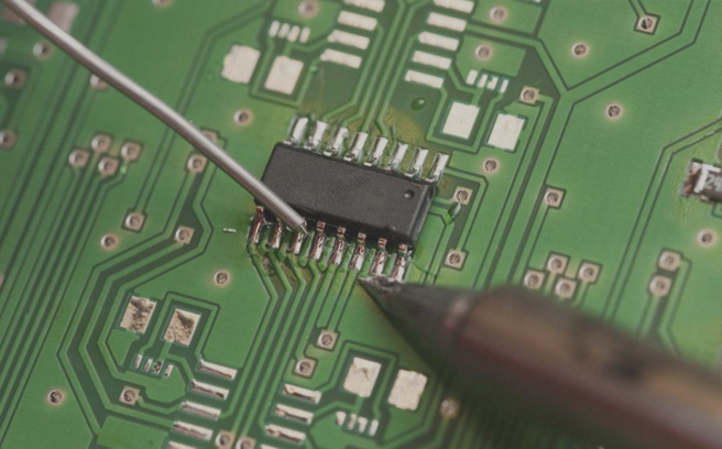 Manual PCB soldering using a soldering iron